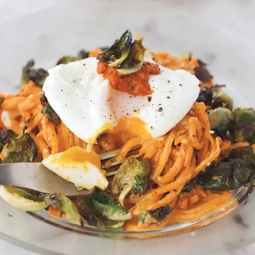 Butternut Squash Noodles With Harissa Cashew Cream And Crispy Brussels Sprout Chips