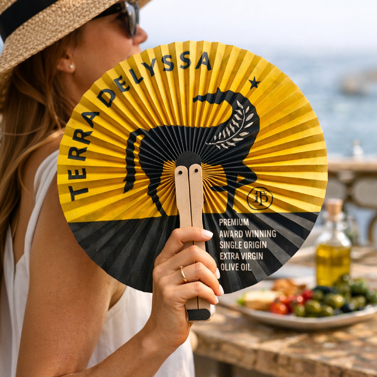 
                  
                    Terra Delyssa Hand Fan
                  
                